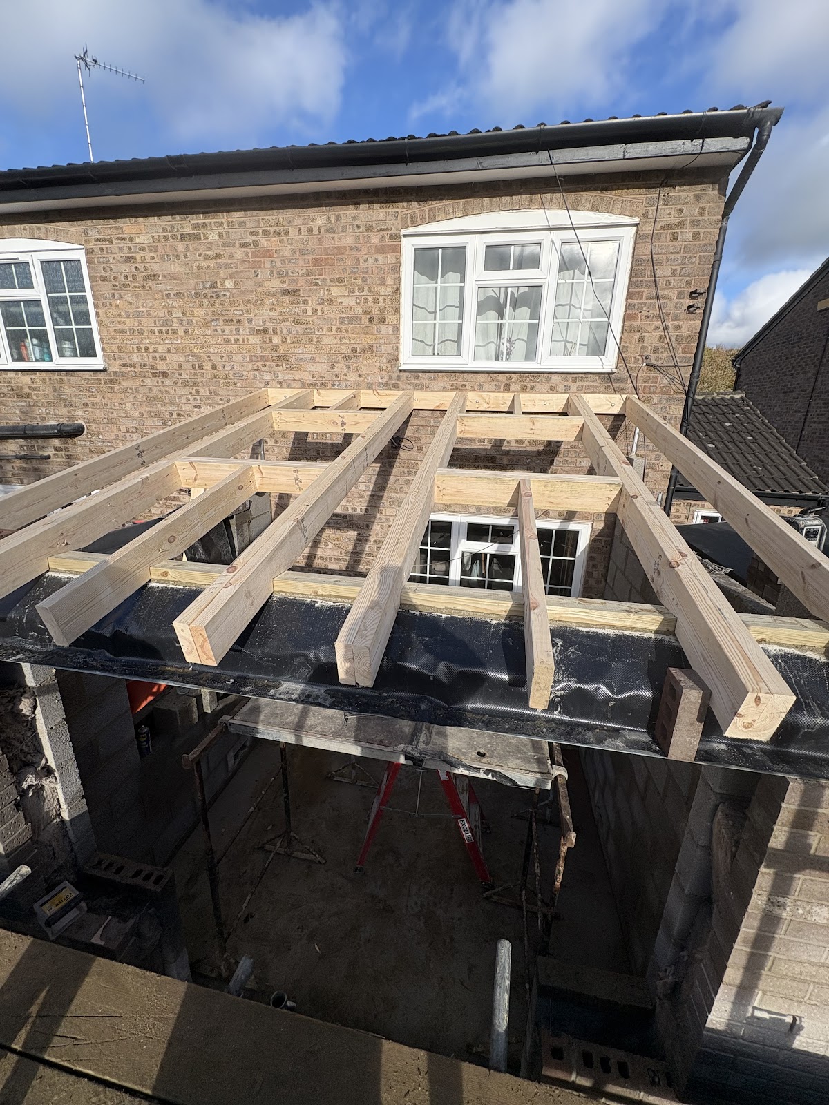 Roof extension timber joist structure under construction